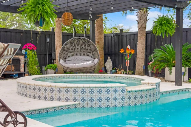 a view of a chairs and table in backyard