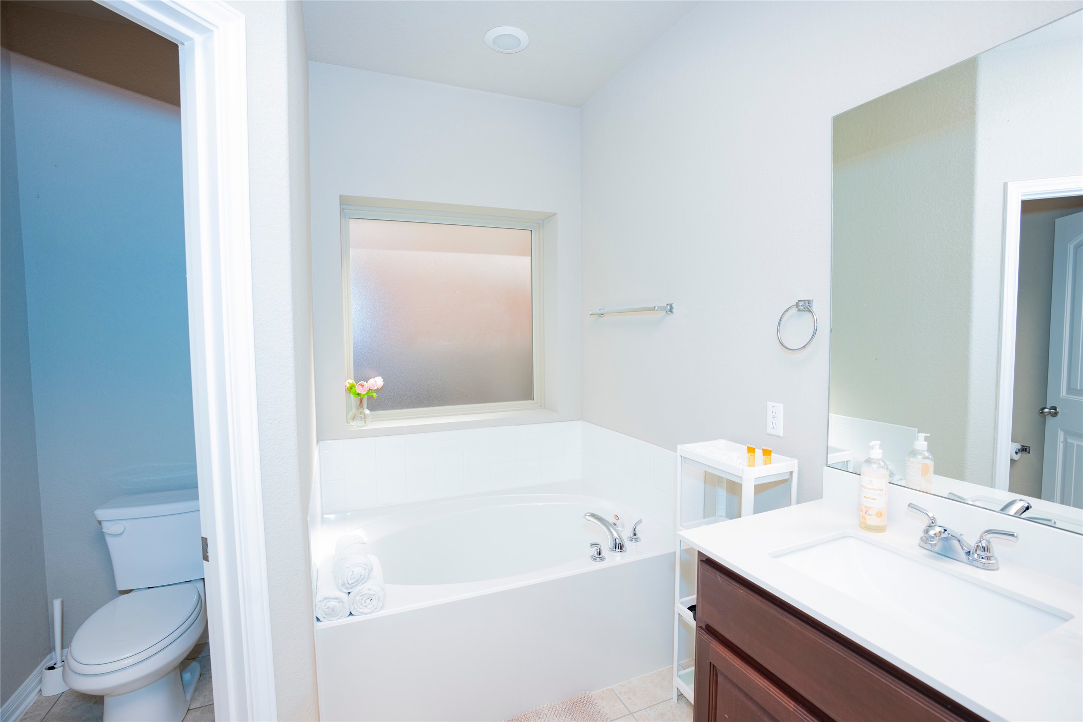20916 Carries Ranch Road Pflugerville, TX 78660 - Photo 27 of 40 a bathroom with a sink a toilet and shower