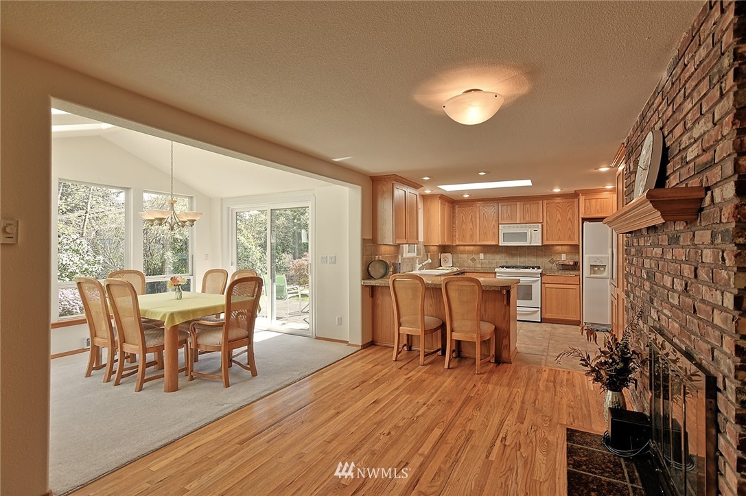 11619 31st Drive Southeast Everett, WA 98208 - Photo 11 of 30 a dining room with furniture and wooden floor