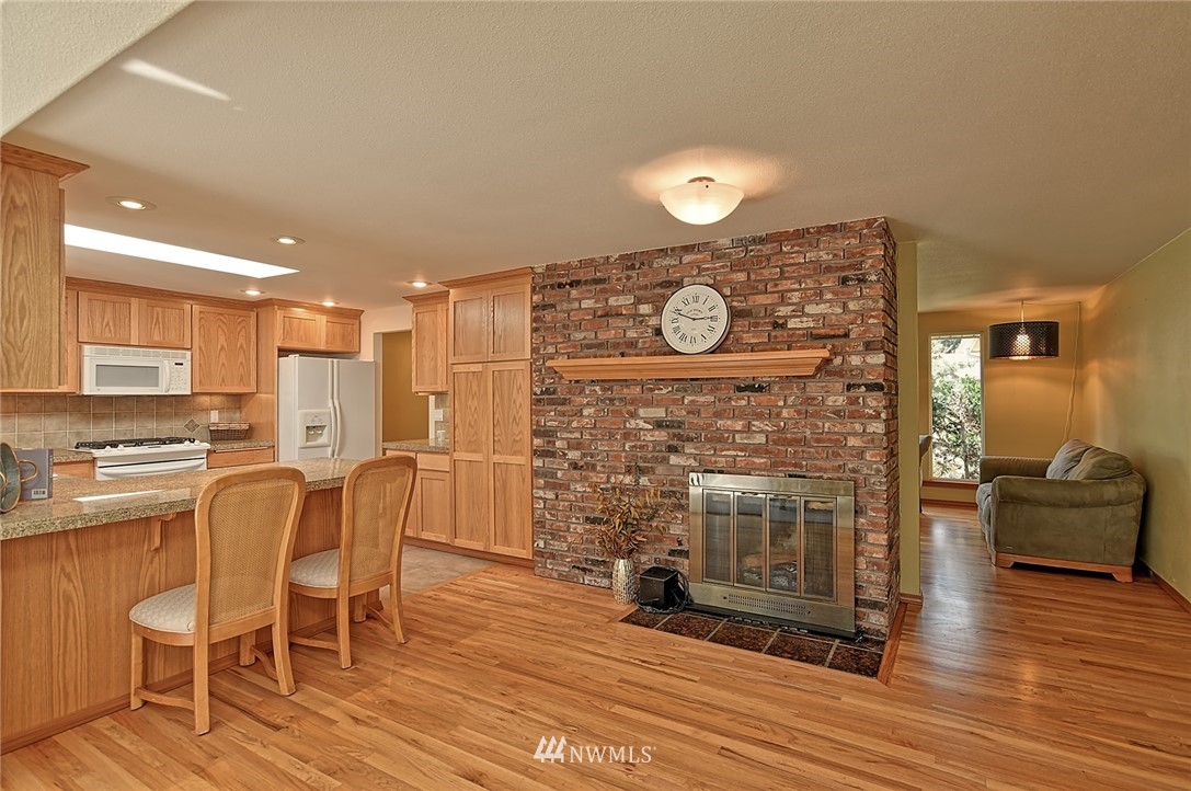 11619 31st Drive Southeast Everett, WA 98208 - Photo 16 of 30 a living room with furniture and a fireplace