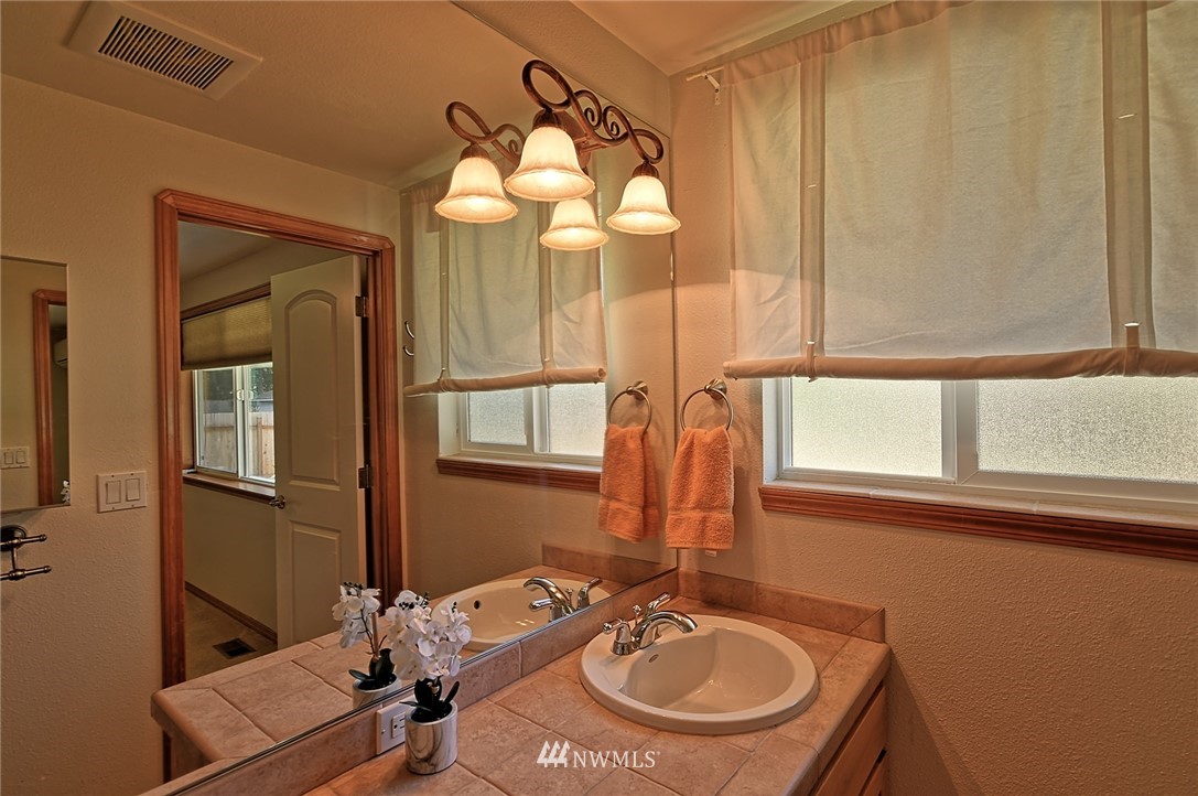 11619 31st Drive Southeast Everett, WA 98208 - Photo 21 of 30 a bathroom with a sink and a mirror
