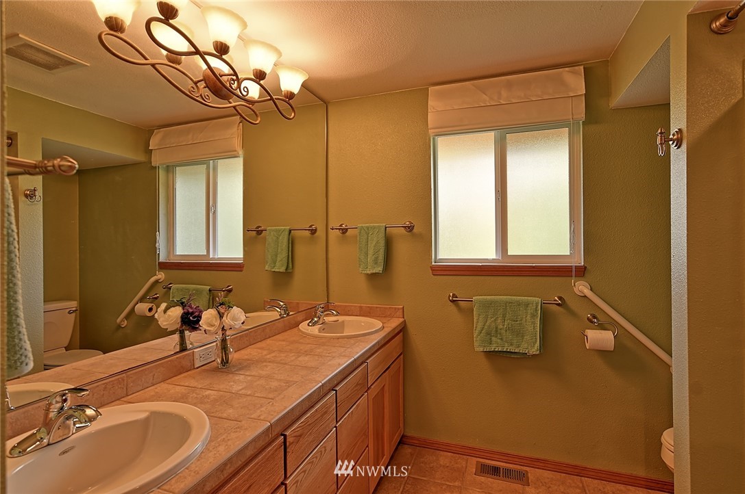 11619 31st Drive Southeast Everett, WA 98208 - Photo 22 of 30 a bathroom with a sink and a mirror
