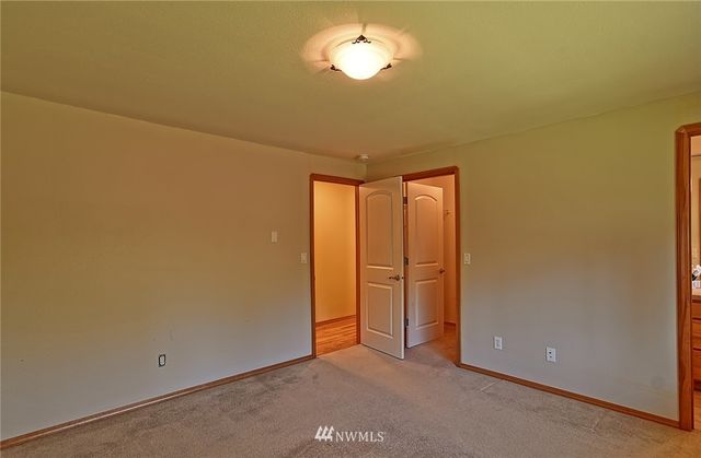 an empty room with a empty space and a window