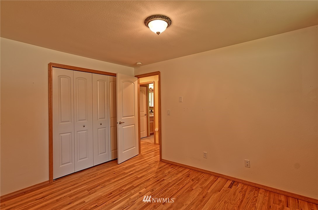 11619 31st Drive Southeast Everett, WA 98208 - Photo 26 of 30 a view of an empty room with wooden floor