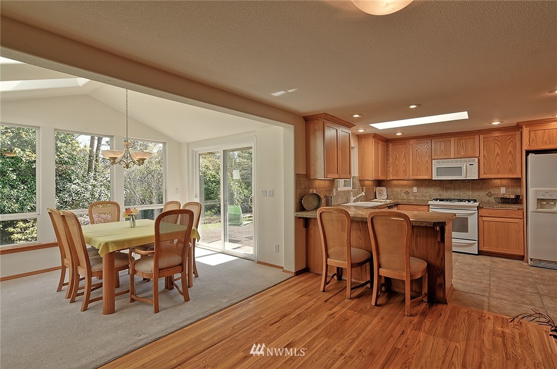 11619 31st Drive Southeast Everett, WA 98208 - Photo 8 of 30 a view of a dining room with furniture window and wooden floor