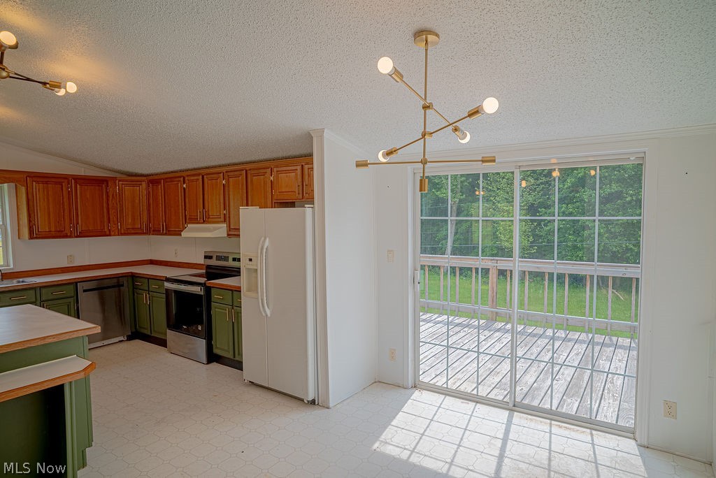 967 Buck Run Road Mineral Wells, WV 26150 - Photo 26 of 50 Open-concept kitchen and dining area featuring a sliding glass door leading to an outdoor deck