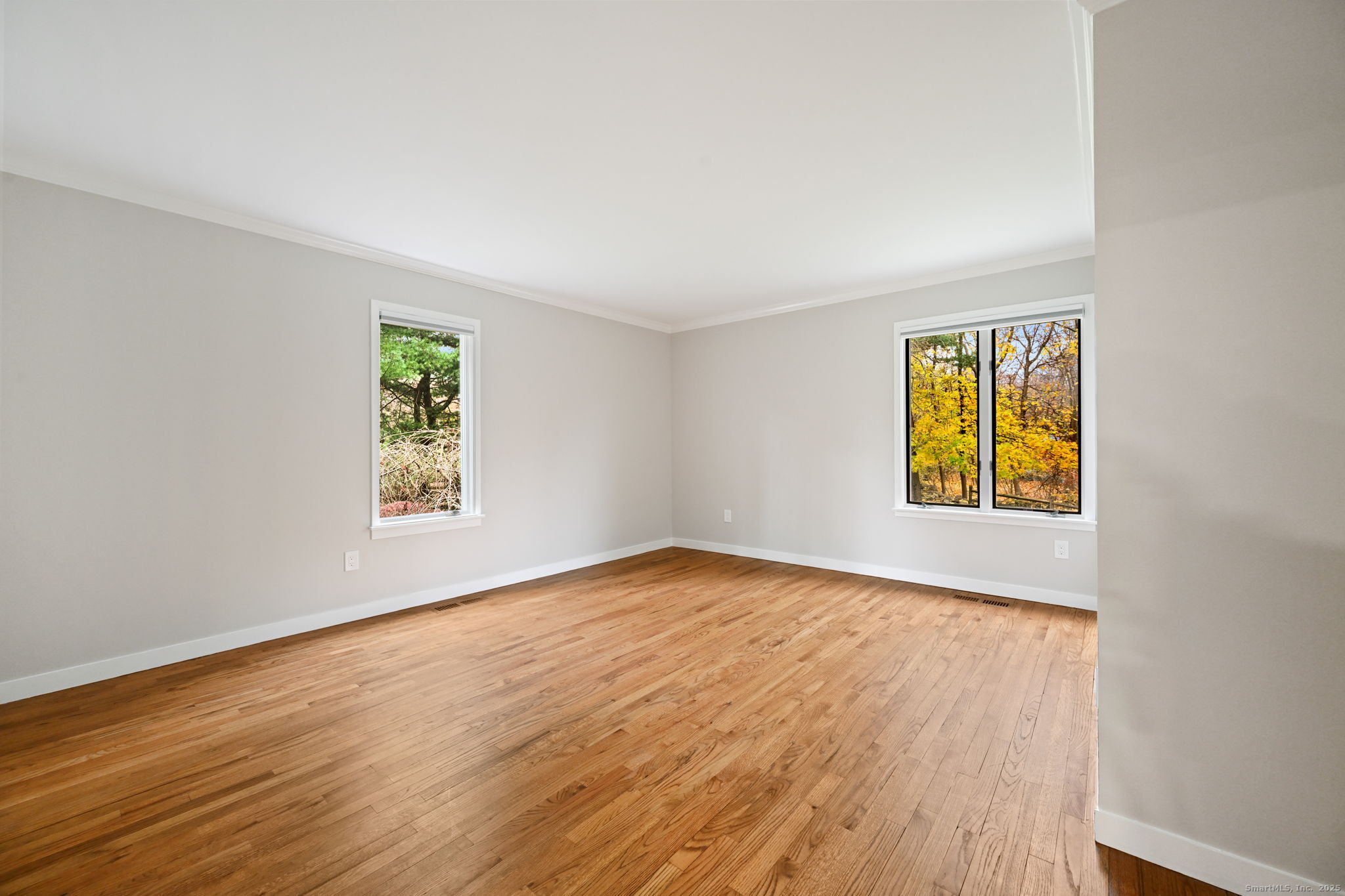 144 West Norwalk Road Norwalk, CT 06850 - Photo 11 of 29 wooden floor in an empty room with a window