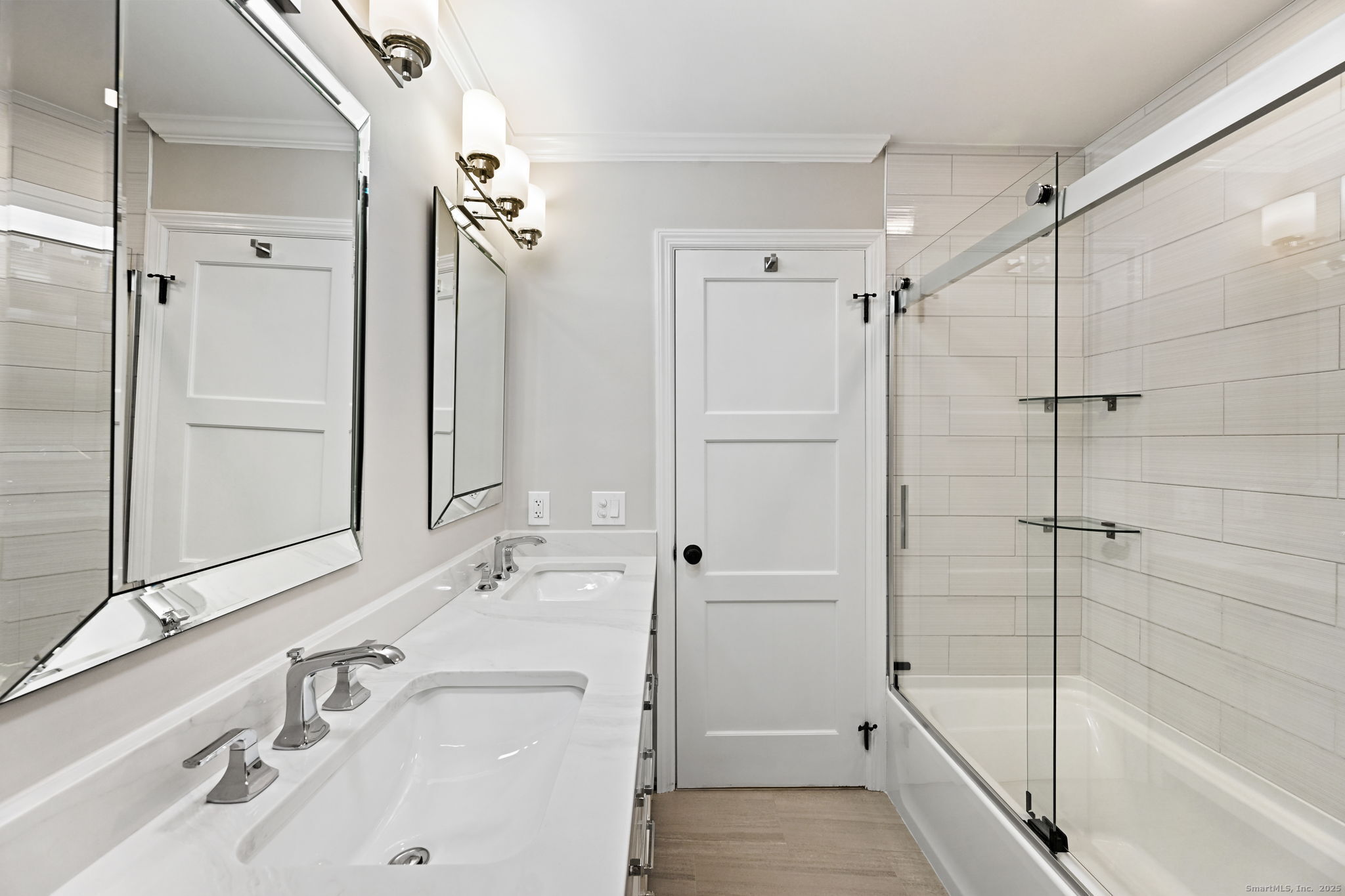 144 West Norwalk Road Norwalk, CT 06850 - Photo 14 of 29 a bathroom with a sink and a mirror with bathtub