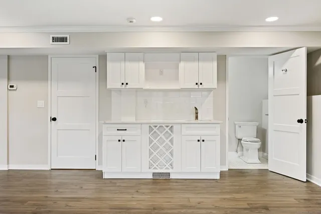 a view of cabinets and wooden floor