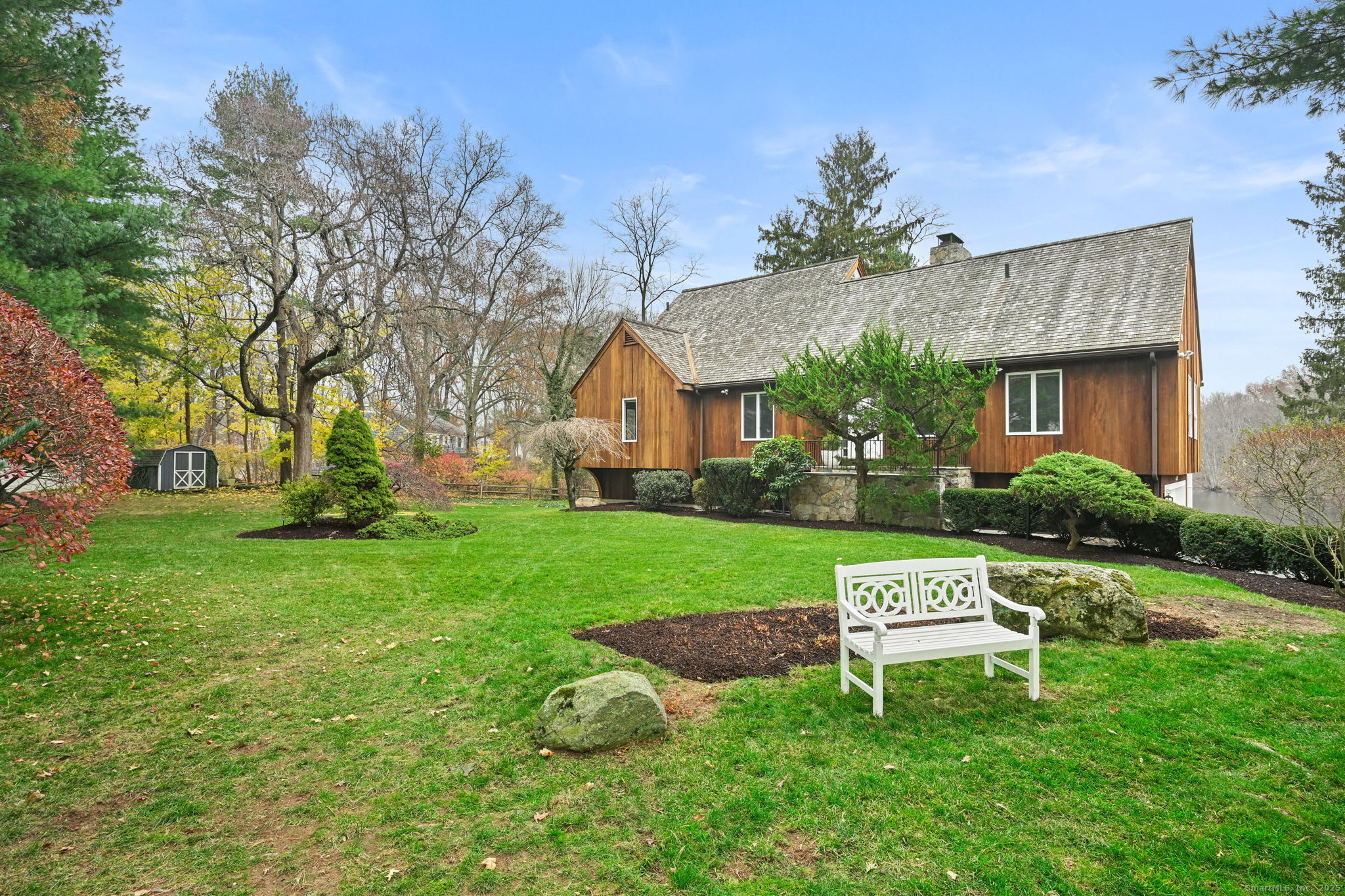 144 West Norwalk Road Norwalk, CT 06850 - Photo 21 of 29 a view of a house with a yard and sitting area