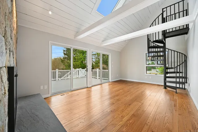 a view of an entryway with wooden floor