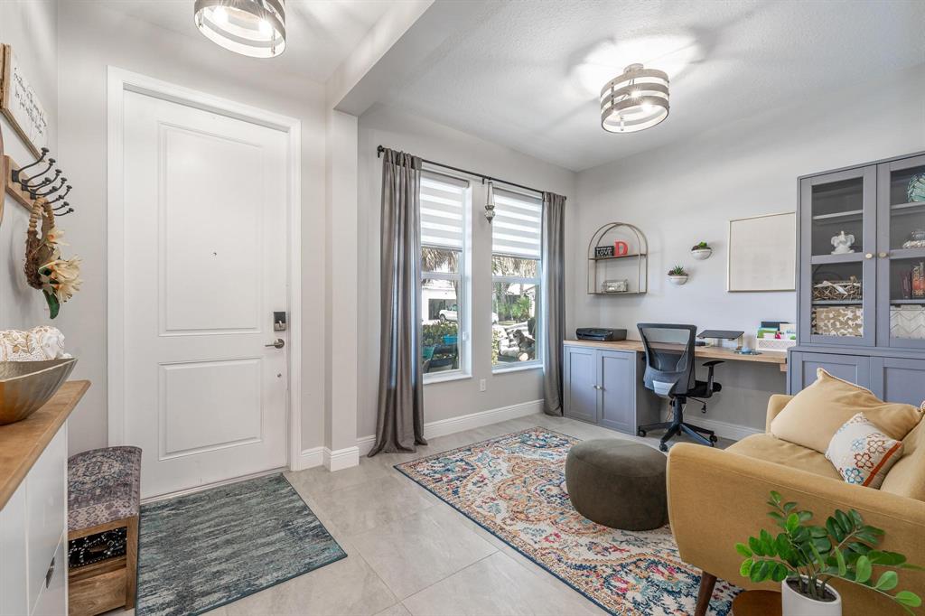 4185 Marina Way Deerfield Beach, FL 33064 - Photo 11 of 40 a living room with furniture and a window
