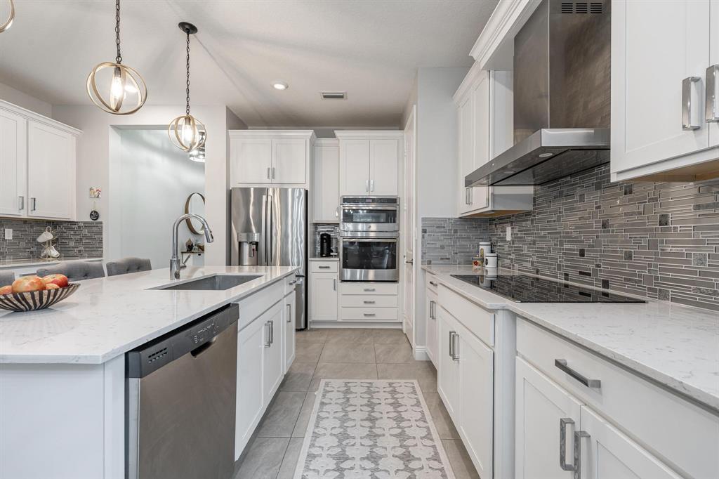 4185 Marina Way Deerfield Beach, FL 33064 - Photo 14 of 40 a kitchen with a sink and cabinets