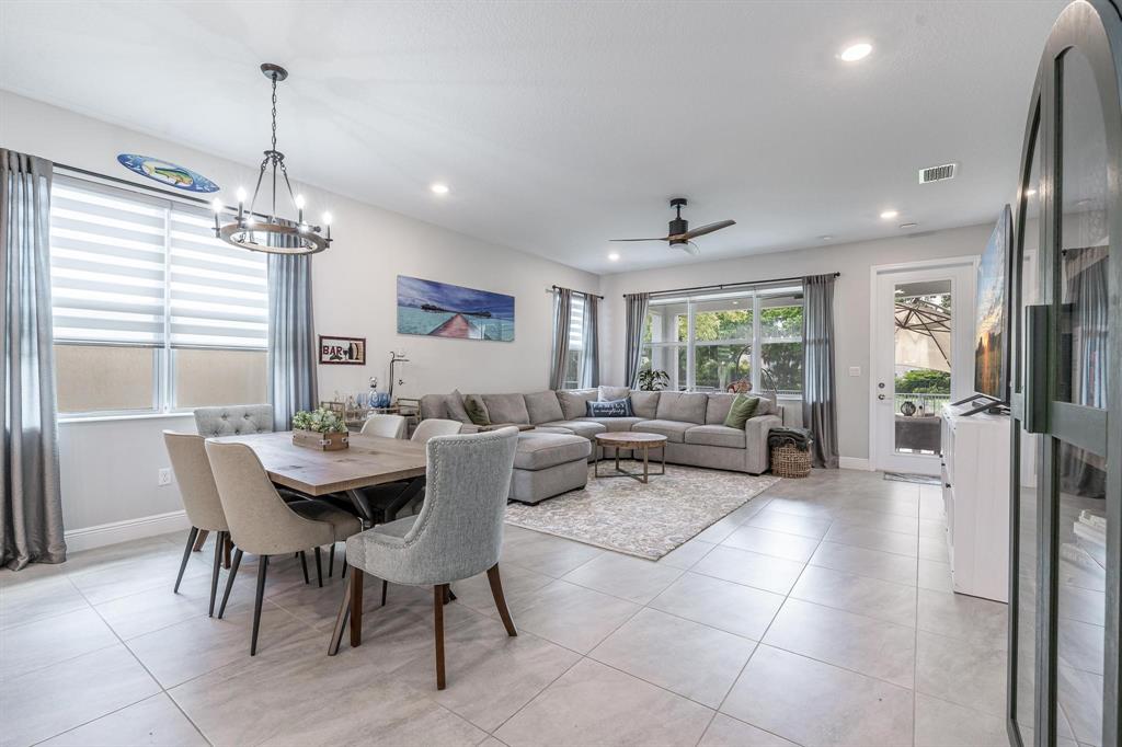 4185 Marina Way Deerfield Beach, FL 33064 - Photo 17 of 40 a living room with furniture and a chandelier
