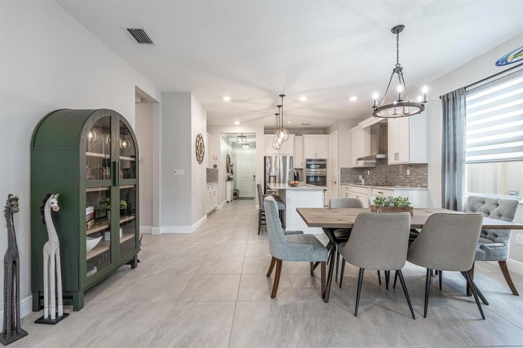 4185 Marina Way Deerfield Beach, FL 33064 - Photo 18 of 40 a dining room with furniture and window