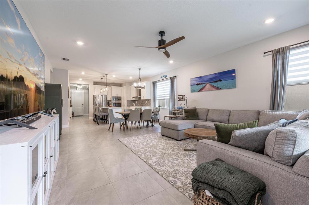 4185 Marina Way Deerfield Beach, FL 33064 - Photo 19 of 40 a living room with furniture and a flat screen tv