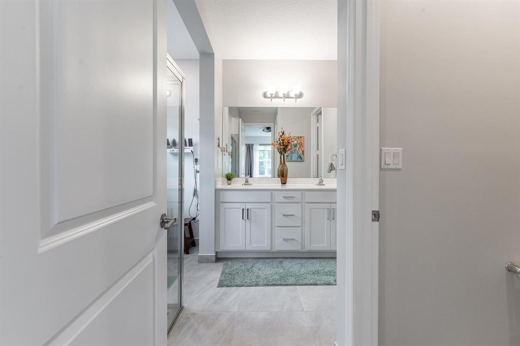 4185 Marina Way Deerfield Beach, FL 33064 - Photo 26 of 40 a bathroom with a granite countertop sink and a mirror