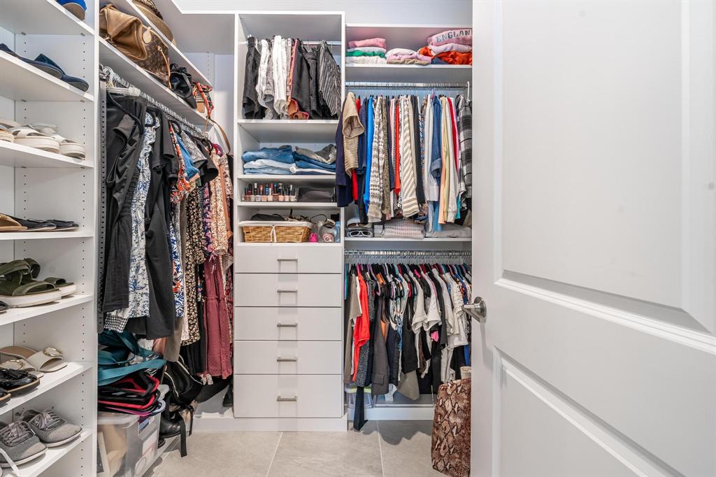 4185 Marina Way Deerfield Beach, FL 33064 - Photo 29 of 40 a view of walk in closet with clothes and shoes