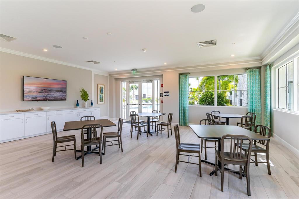 4185 Marina Way Deerfield Beach, FL 33064 - Photo 36 of 40 a dining room with furniture window and wooden floor