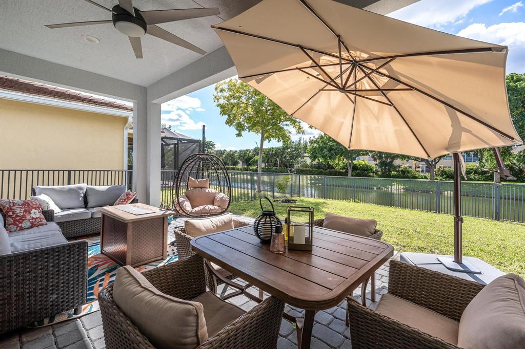 4185 Marina Way Deerfield Beach, FL 33064 - Photo 5 of 40 a view of a patio with couches chairs and a umbrella