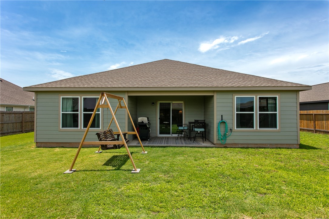 137 Windmill Road Somerville, TX 77879 - Photo 20 of 22 a view of a house with a patio and a yard