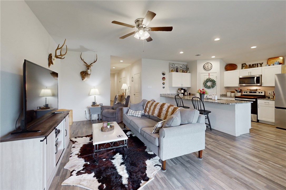 137 Windmill Road Somerville, TX 77879 - Photo 5 of 22 a living room with furniture and a flat screen tv