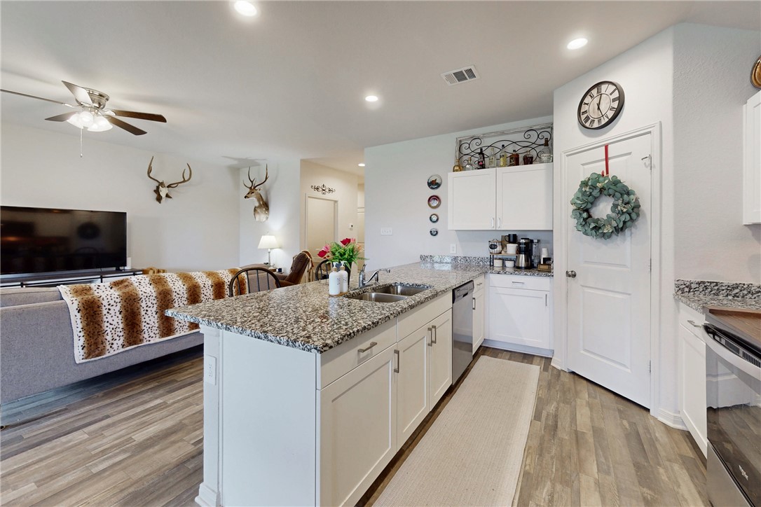137 Windmill Road Somerville, TX 77879 - Photo 22 of 22 a large white kitchen with a stove a sink and a refrigerator