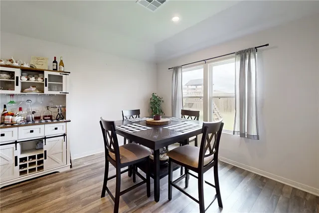 a kitchen with granite countertop a stove and a microwave