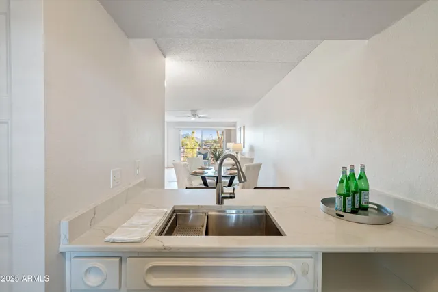 a kitchen with stainless steel appliances white cabinets and a stove