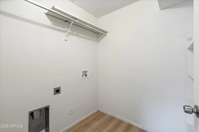 a bathroom with a sink vanity granite and shower