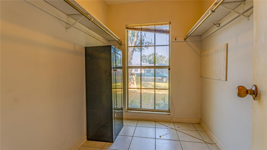 633 Huntington Street Brandon, FL 33511 - Photo 13 of 35 a view of an empty room with a window