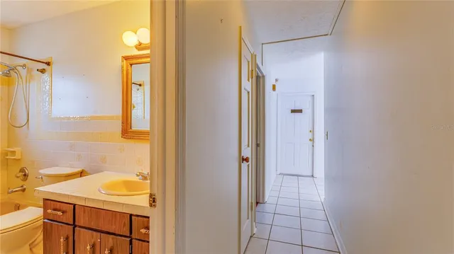 a view of a brick house with many windows