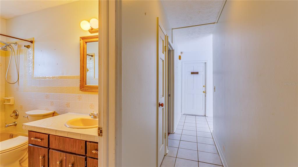 633 Huntington Street Brandon, FL 33511 - Photo 28 of 35 a bathroom with a sink and a mirror