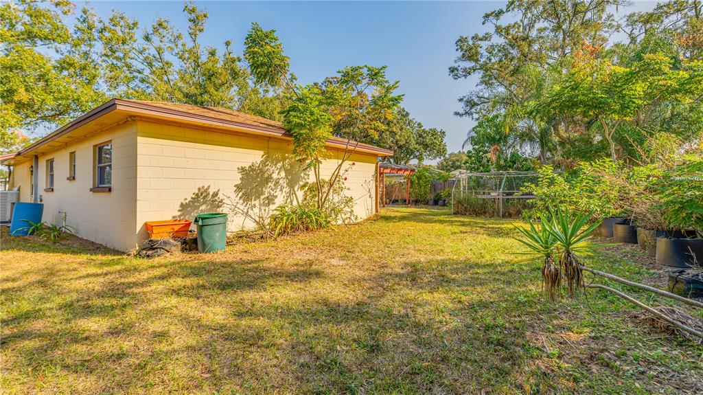 633 Huntington Street Brandon, FL 33511 - Photo 31 of 35 a view of a house with a yard