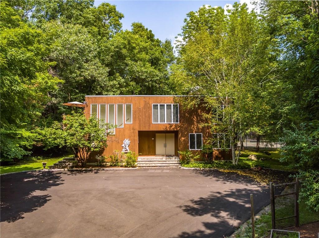 16 Dogwood Hills Road Pound Ridge, NY 10576 - Photo 1 of 1 Artist's studio with caretaker/guest apartment. Tennis court in the background.