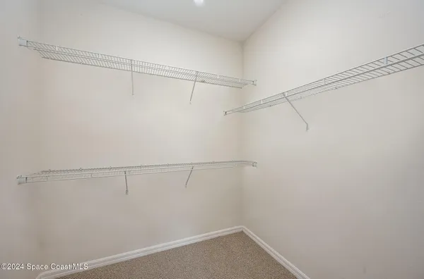 a view of a room with racks on the wall