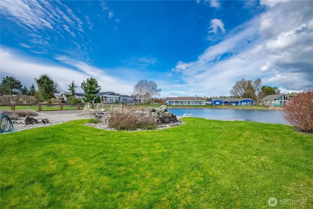 a view of yard with outdoor seating and hardwood