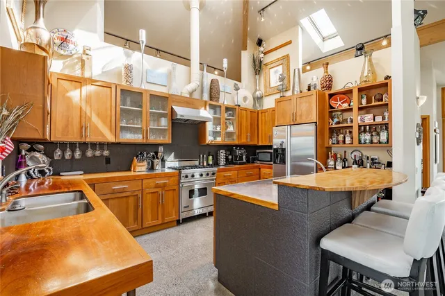 a view of a kitchen with a table and chairs