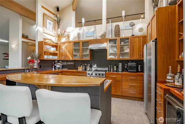 a dining table with chairs and chandelier