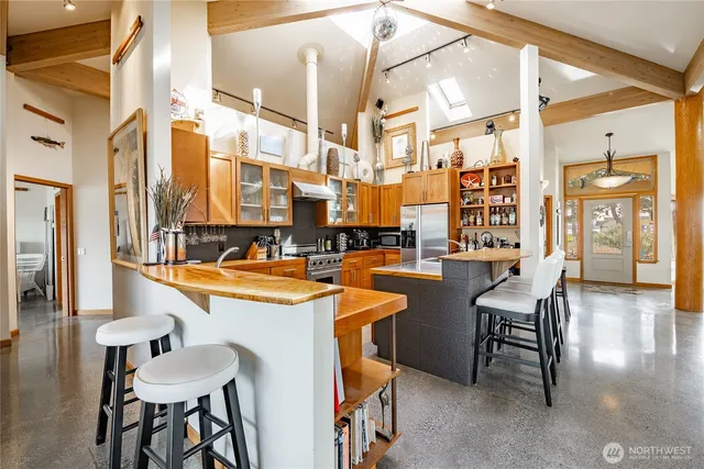 a room with chairs and view of living room