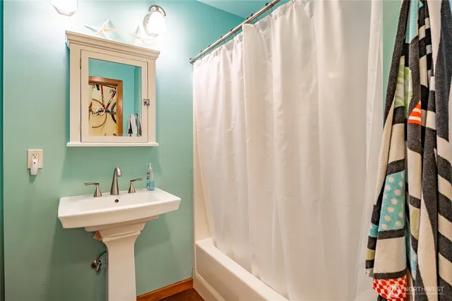 a bathroom with a sink and a mirror