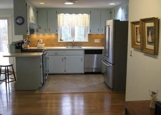 64 Ansel Howland Road Centerville, MA 02632 - Photo 11 of 31 a kitchen with stainless steel appliances granite countertop a refrigerator a sink and a stove
