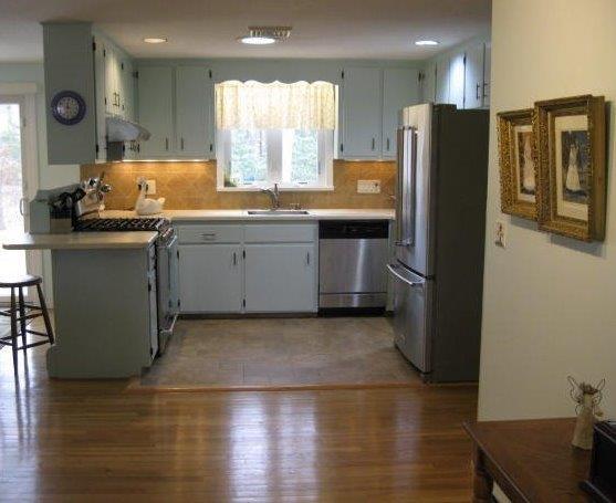 64 Ansel Howland Road Centerville, MA 02632 - Photo 13 of 31 a kitchen with stainless steel appliances granite countertop a refrigerator and a sink