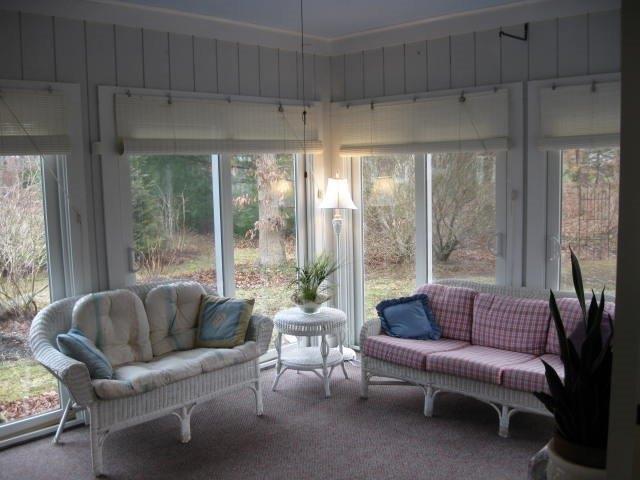 64 Ansel Howland Road Centerville, MA 02632 - Photo 16 of 31 a living room with furniture and a large window