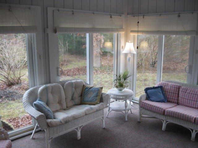 64 Ansel Howland Road Centerville, MA 02632 - Photo 18 of 31 a living room with furniture and a large window