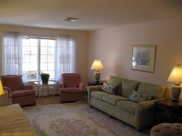 64 Ansel Howland Road Centerville, MA 02632 - Photo 19 of 31 a living room with furniture and a window