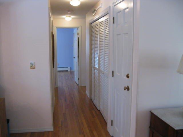 64 Ansel Howland Road Centerville, MA 02632 - Photo 25 of 31 a view of a hallway with wooden floor