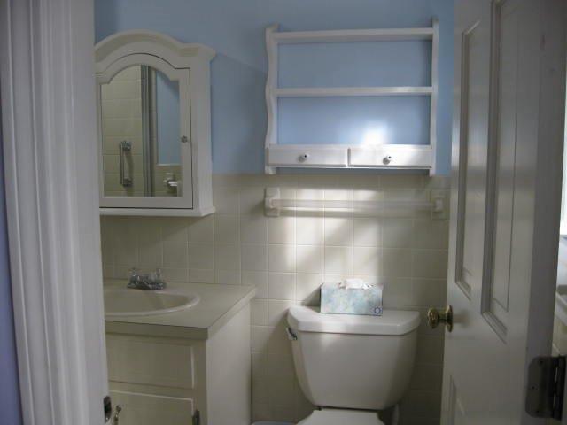 64 Ansel Howland Road Centerville, MA 02632 - Photo 26 of 31 a bathroom with a toilet sink and mirror