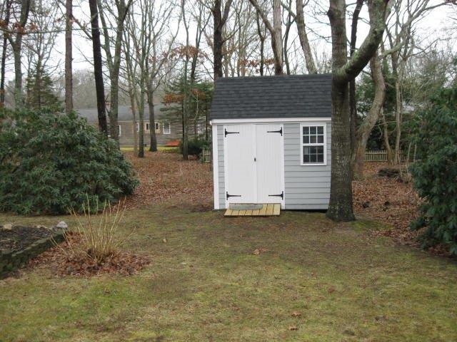 64 Ansel Howland Road Centerville, MA 02632 - Photo 29 of 31 a view of a house with a space and tree