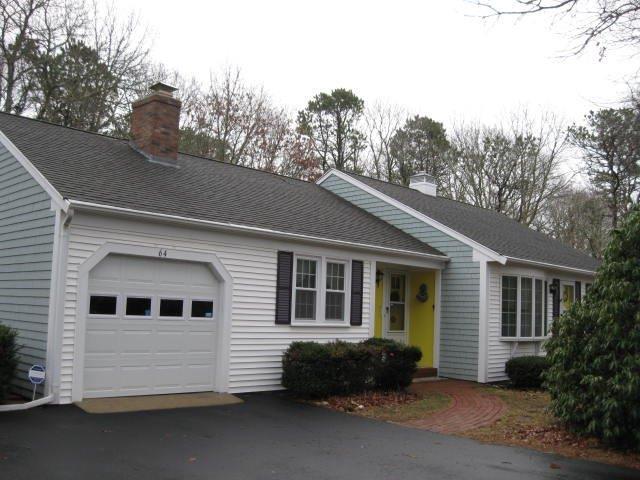 64 Ansel Howland Road Centerville, MA 02632 - Photo 3 of 31 a front view of a house with a yard